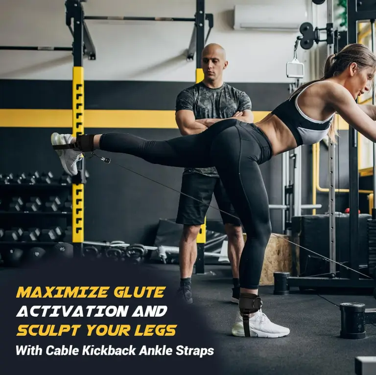 Woman doing a cable kickback with an ankle strap while a trainer watches